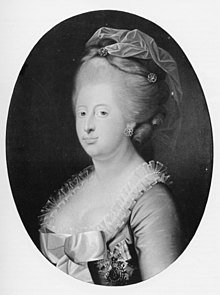 Black-and-white, half-length portrait of a woman turned towards the left and staring sternly at the viewer. Her dress dips down, revealing her bosom, and is decorated with a ruffle around the edges and a large bow in front. She is wearing a wig and a headdress made of a material that resembles her dress.