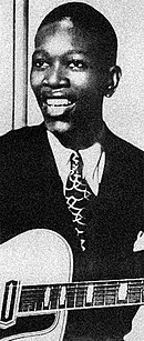 Christian playing guitar in-studio, summer 1940