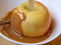 Coating the apple with caramel (3445972588).jpg