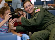 U.S. Air Force Staff Sgt. Stacy Pearsall, from the 1st Combat Camera Squadron, shows American children how to capture an image inside the terminal on Ramstein Air Base, Germany, July 22, 2006. The Air Force is flying American citizens who departed Lebanon to the United States. (U.S. Air Force photo by Tech. Sgt. Russell E. Cooley IV) (Released) GERMANY-2006-SLP-004.jpg