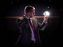 Gutenplan peers into a crystal ball. Gutenplan crystal ball.jpg