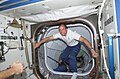 Astronauts from STS-110 mission steps into the Destiny laboratory through the Pressurized Mating Adapter 2 (PMA-2) Atlantis and the station.