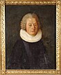 Das abgebildete Gemälde zeigt das Brustbild eines Pfarrers. Er trägt eine graue Perücke mit vier Locken an jeder Seite. Sein weißer Kragen ist kreisrund und aufwändig gefältelt.