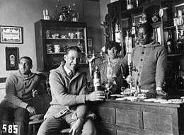 Andrade (behind the bar) serving a drink to his Uruguayan teammates in Amsterdam (1928)