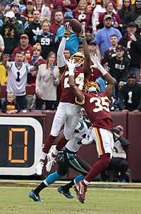 Norman making an interception against the Panthers in 2018