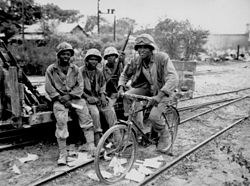 African-American Marine ammunition carriers on Saipan. June 1944 Saipan - USMC ammunition carriers relax after battle - 103.jpg