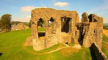 The two remaining significant ruins of Kendal Castle. In the foreground is part of the walls of the old manor hall, while the only surviving tower of the castle is visible rear left. Kendal Castle Ruins.jpg