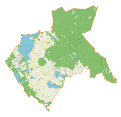 Mapa konturowa gminy Kruklanki, na dole znajduje się owalna plamka nieco zaostrzona i wystająca na lewo w swoim dolnym rogu z opisem „Sołtmany”