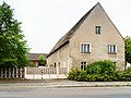 Side building of a three-sided courtyard