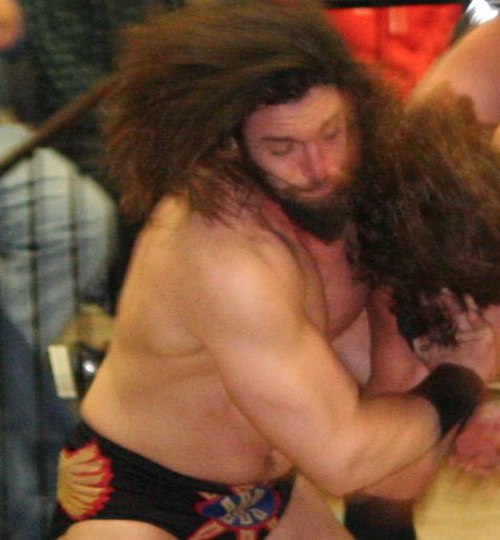 Logan Shulo wrestling at an International Wrestling Cartel (IWC) event in February 2012