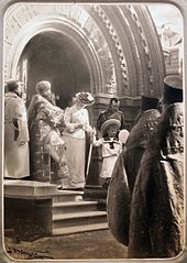 Nicholas II, Alexandra and Olga Nikolaevna come out of the Chapel.jpg