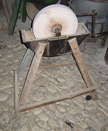 A grinding wheel with a reservoir to hold water as a lubricant and coolant. Noe schleifstein.jpg