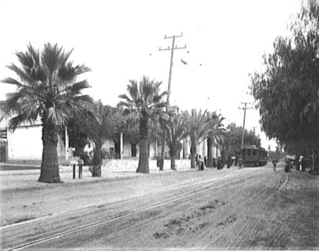 Old Mission Trolley streetcar of the Pacific Electric makes a stop at Mission San Gabriel Arcángel, 1905.