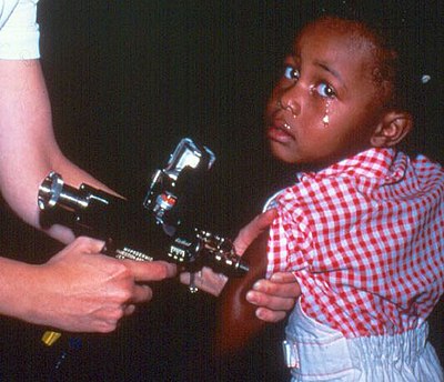 A jet injector, shown here used as part of a child vaccination program.