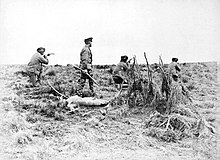 Julius Popper during a manhunt of the Selk'nam people. In the late 19th century estancieros and gold prospectors launched a campaign of extermination against the indigenous peoples of Tierra del Fuego. Popper en caceria.jpg