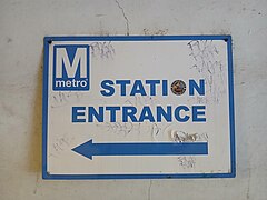 STATION ENTRANCE sign with graffiti and sticker.jpg