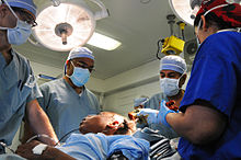 Sanjay Gupta & medical team prepare for brain surgery on USS Carl Vinson (CVN-70) 2010-01-18.jpg