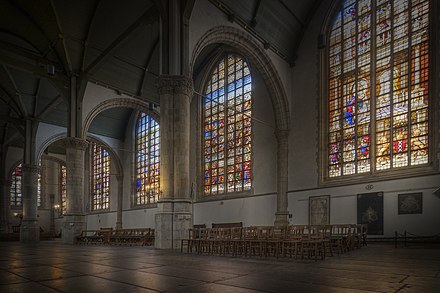 The stained glass windows of the St. Janskerk depict scenes from the bible and Dutch history