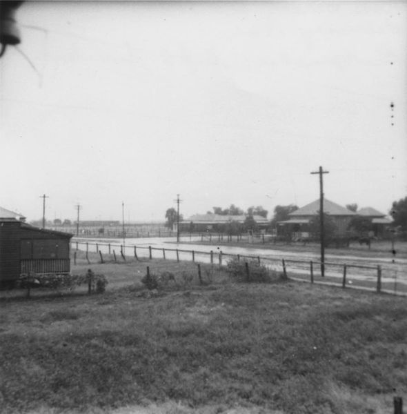 File:StateLibQld 1 121364 Welcome summer rain on Rose Street, Blackall, 1941.jpg