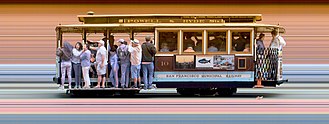 Fixed slit photo of a San Francisco cable car, showing prominent striped background. The vertical axis of the photo is a spatial dimension as with normal photos, but the horizontal axis is a time axis, showing the same point on the street as the cable car passed. Strip photo of San Francisco Cable Car 10.jpg