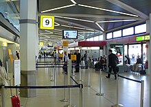 Tegel Airport is famous for its short walking distances, as seen here in Terminal A: buses, taxis and cars can drop off passengers outside the windows on the right, check-in and direct gate access is on the left