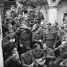 Men of the 2/6th Battalion, Queen's Royal Regiment (West Surrey) celebrate Christmas in Italy, 25 December 1943. The British Army in Italy 1943 NA10138.jpg