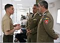 U.S. Marine Corps Lt. Col. Joshua P. Hallet, left, a liaison officer with Black Sea Rotational Force 11, speaks with Romanian Land Forces, Romanian Land Forces (RLF) Master Sgt. Terebisi Florin, the advisor to 110426-M-OB762-002.jpg