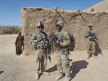 A U.S. Army 68W "Combat Medic Specialist" (center-left, viewers right) in Afghanistan. Note that the only distinguishing feature is the medical pack on his back. U.S. army medic Afganistan.jpg