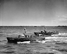 Two of USCGC Tiburon's sister ships, part of the Matchbox Fleet patrolling off Normandy Beaches during World War II USCG-20 and USCG-21.jpg