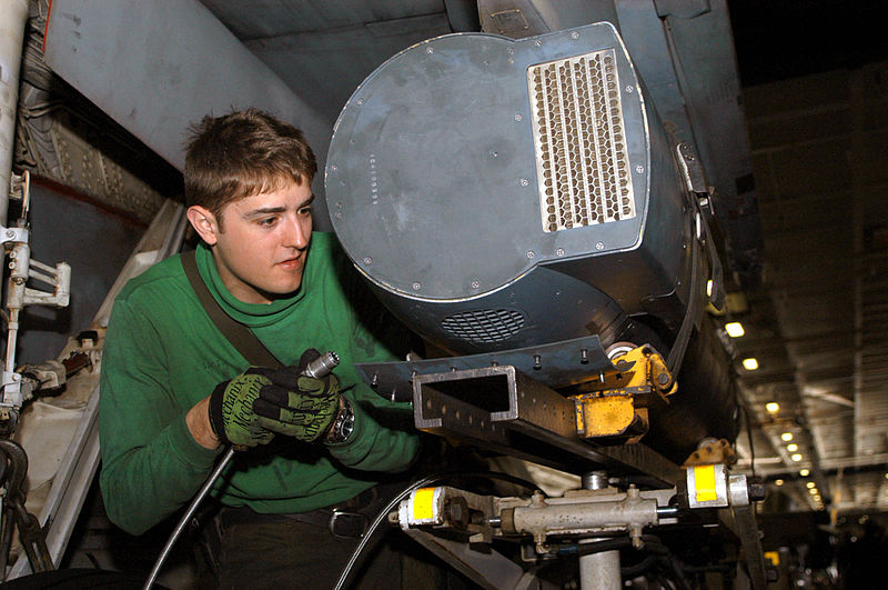 File:US Navy 030323-N-9403F-168 Photographer's Mate 2nd Class Jacob Lantz from Greely, Co., prepares to fill a Low Altitude Navigational and Targeting Infrared for Night (LANTIRN) pod with oil aboard USS Abraham Lincoln (CVN 72).jpg