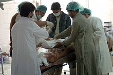 Pakistani doctors operate on an injured woman in Muzafarabad in 2005 US Navy 051013-N-8796S-208 Pakistani doctors operate on an injured woman at one of the only hospitals left operational in the city of Muzafarabad, Pakistan.jpg