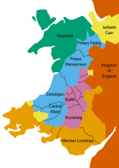 Coloured map depicting Wales (adjacent to the Kingdom of England, coloured dark orange) following the Treaty of Montgomery of 1267. Gwynedd, Llywelyn ap Gruffudd's principality, is green; the territories conquered by Llywelyn are purple; the territories of Llywelyn's vassals are blue; the lordships of the Marcher barons are shown as light orange; and the lordships of the King of England are shown in yellow.