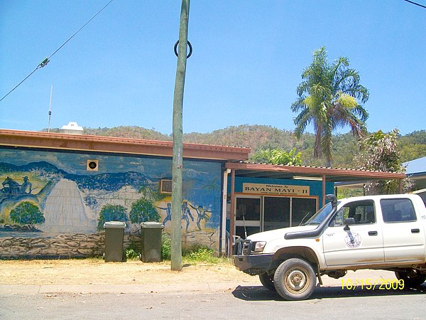 Wujal Wujal's one general store, in Wujal Wujal's main street, with mural including Wujal Wujal falls, and Wujal Wujal Council vehicle parked out fron