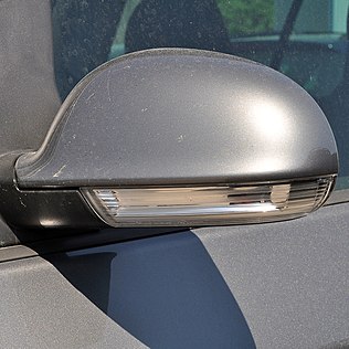 Mirror-mounted side turn signal repeater on a Volkswagen Golf Mk5
