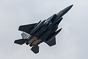 An F-15E Strike Eagle, tail number 91-0302, taking off from RAF Lakenheath in England. The aircraft is assigned to the 492nd Fighter Squadron.