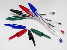 Bic Cristal ballpoint pens shown in four basic ink colors 4 Bic Cristal pens and caps.jpg