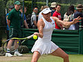 Aliaksandra Sasnovich competing in the third round of the 2015 Wimbledon Qualifying Tournament at the Bank of England Sports Grounds in Roehampton, England. The winners of three rounds of competition qualify for the main draw of Wimbledon the following week.