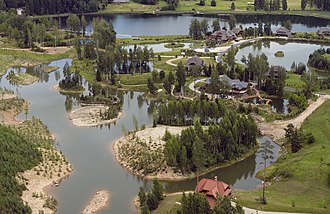 Amatciems, a settlement of Ringing Cedars' Anastasians in Drabesi Parish, Latvia. Anastasianism is a Russian-originated modern Pagan movement that sacralises environmental and human nativity (Rod), and is therefore regarded as a "nature religion". Amatciems July 2015.jpg