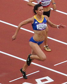 Andreea Ograzeanu runs the evening heat in the women's 100 m. Andreea Ograzeanu 2012 Olympics.jpg
