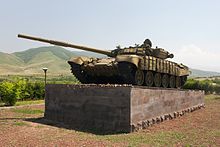 A restored Armenian T-72, knocked out of commission while attacking Azeri positions in Askeran District, serves as a war memorial on the outskirts of Stepanakert. Askeran T-72.jpg
