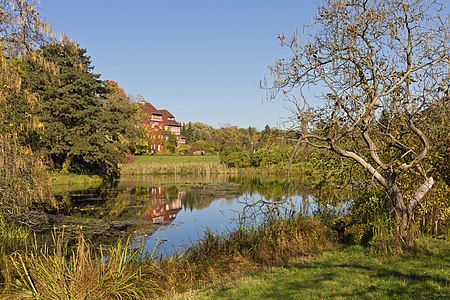 Autumn in Botanical Garden of Berlin (with gardener's house in the background)