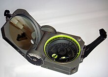 A standard Brunton Pocket Transit, commonly used by geologists for mapping and surveying Brunton.JPG