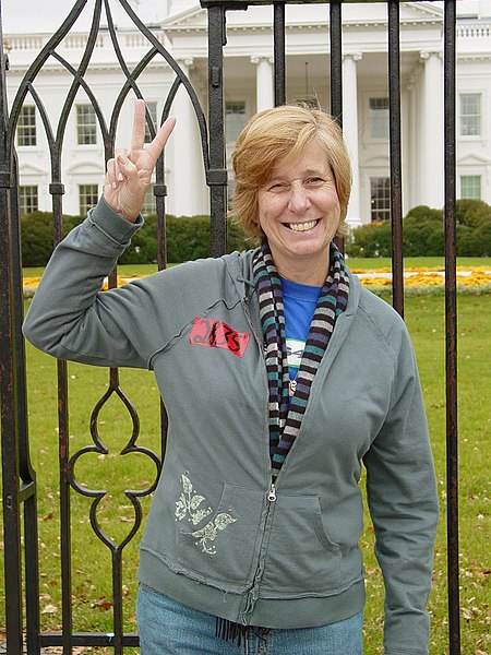 Sheehan gives the peace sign in front of the White House in 2006.