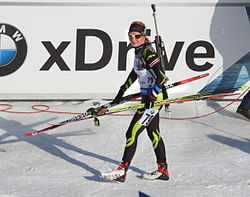 Competitor transporting the rifle on the back using a carrying harness.