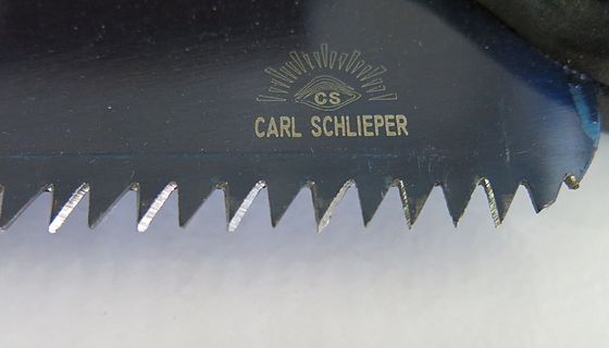 Close view of cross-cut saw teeth