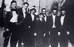 The only known photo of all five Marx brothers with their parents in New York City, 1915; from left: Groucho (aged 25), Gummo (aged 22), Minnie (mother), Zeppo (aged 14), Frenchie (father), Chico (aged 28), and Harpo (aged 27) Early marx brothers with parents.jpg