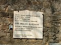 Lapide in memoria di don Ubaldo Marchioni affissa sui resti della chiesa di Casaglia di Monte Sole