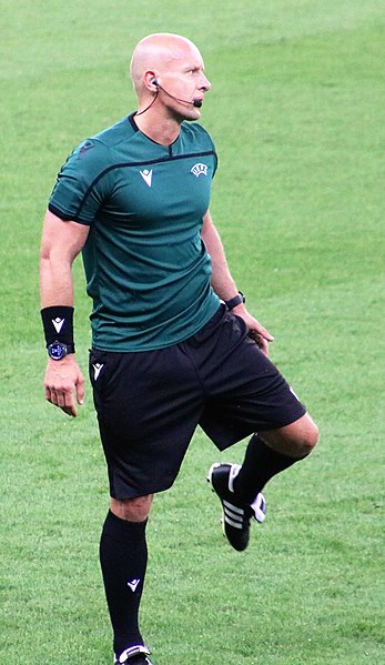 Marciniak during a pre-match warm-up in 2021