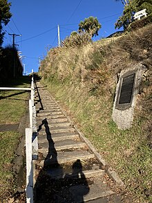 The Falcon Street steps where the cable car ran. The plaque commemorates the renaming of James Street into Falcon Street after Robert Falcon Scott, and the naming of Oates Street after Lawrence Oates. Falcon Street steps.jpg