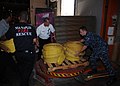 Firefighters load firefighting equipment onto a pallet for shipment to Russia.jpg